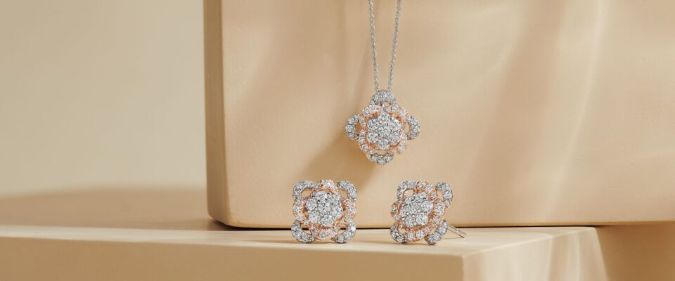 white and rose gold floret diamond pendant and stud earrings